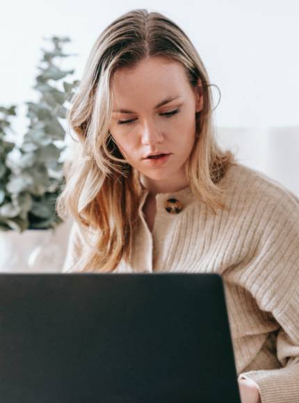 blond girl searching on PC